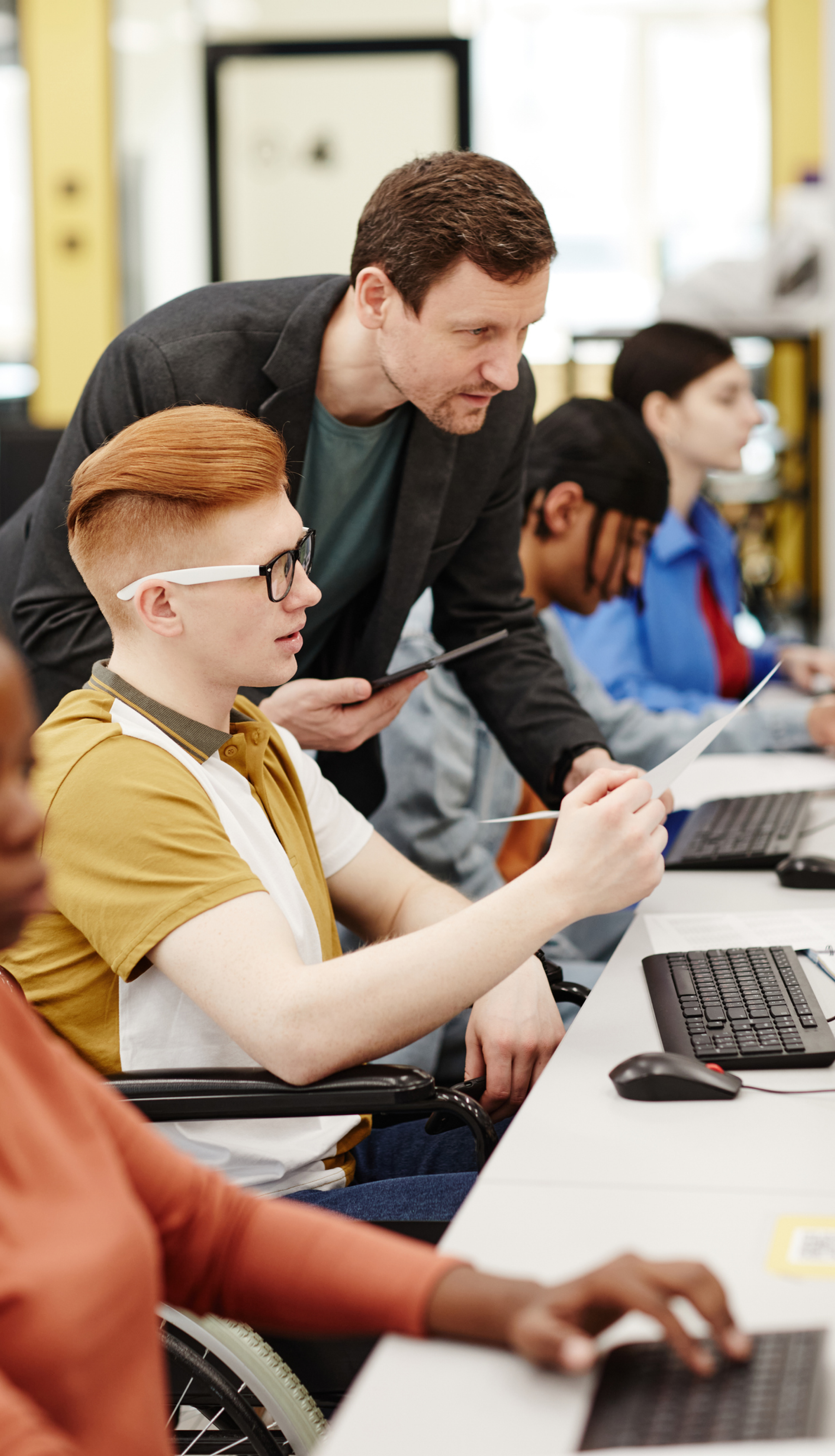 C|ND: Hands-On Network Security Training Hands-on network security training in a lab environment with multiple monitors displaying network diagrams and security tools.